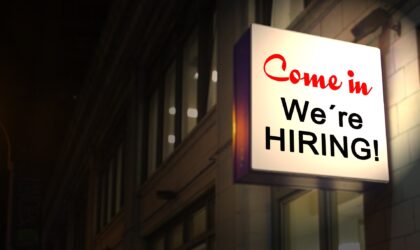 A lit-up sign on a building saying "Come in. We're hiring!"Photo by Gerd Altmann / Pixabay