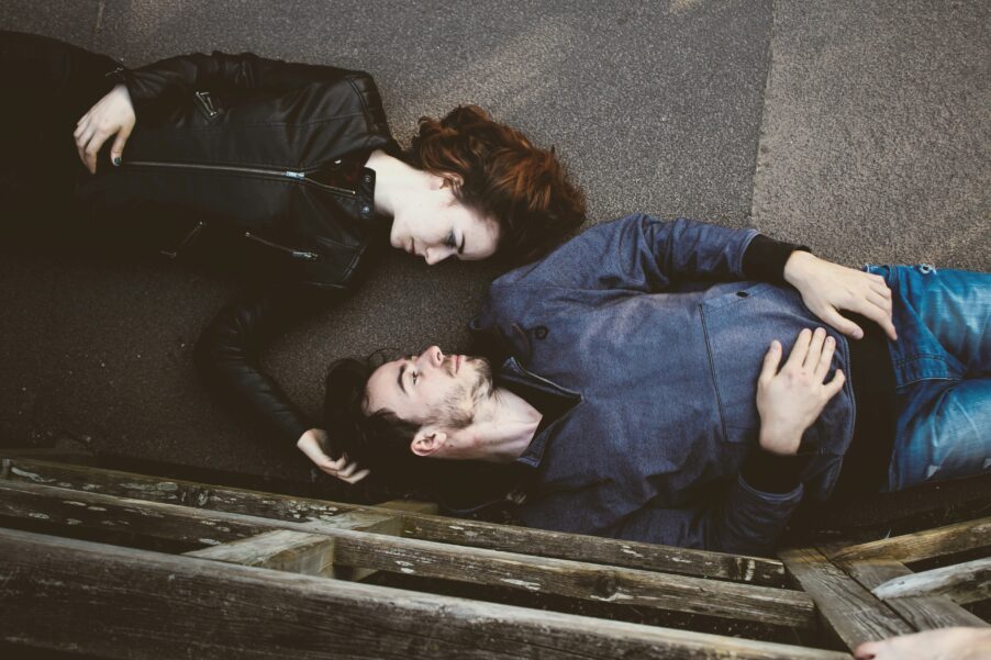 Couple lying on the floor. Photo by Toa Heftiba / Unsplash