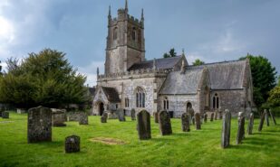 Avebury, Wiltshire, UK - june 10, 2023 : Avebury village church under stormy skies