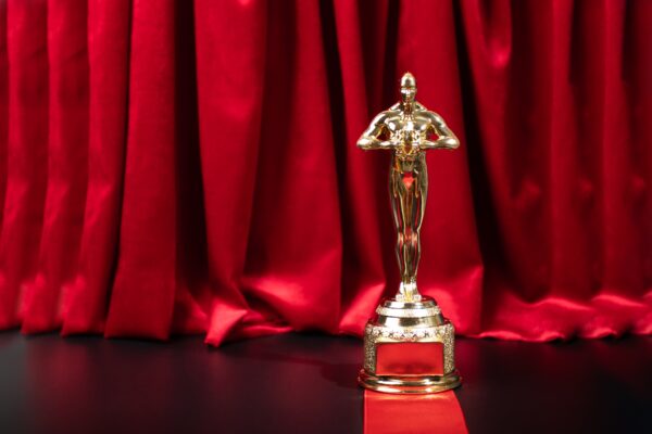 Oscar award on the red carpet, luxury movie prize, academy trophy honoring the best in film