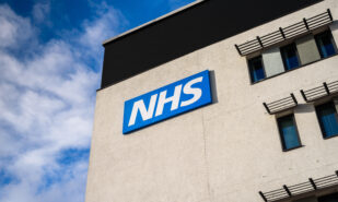 View of the NHS (National Health Service) logo at the Springfields Medical Centre in the centre of Warrington, Cheshire