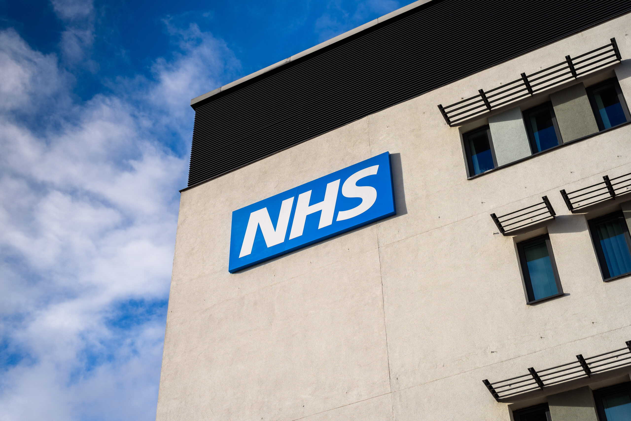 View of the NHS (National Health Service) logo at the Springfields Medical Centre in the centre of Warrington, Cheshire