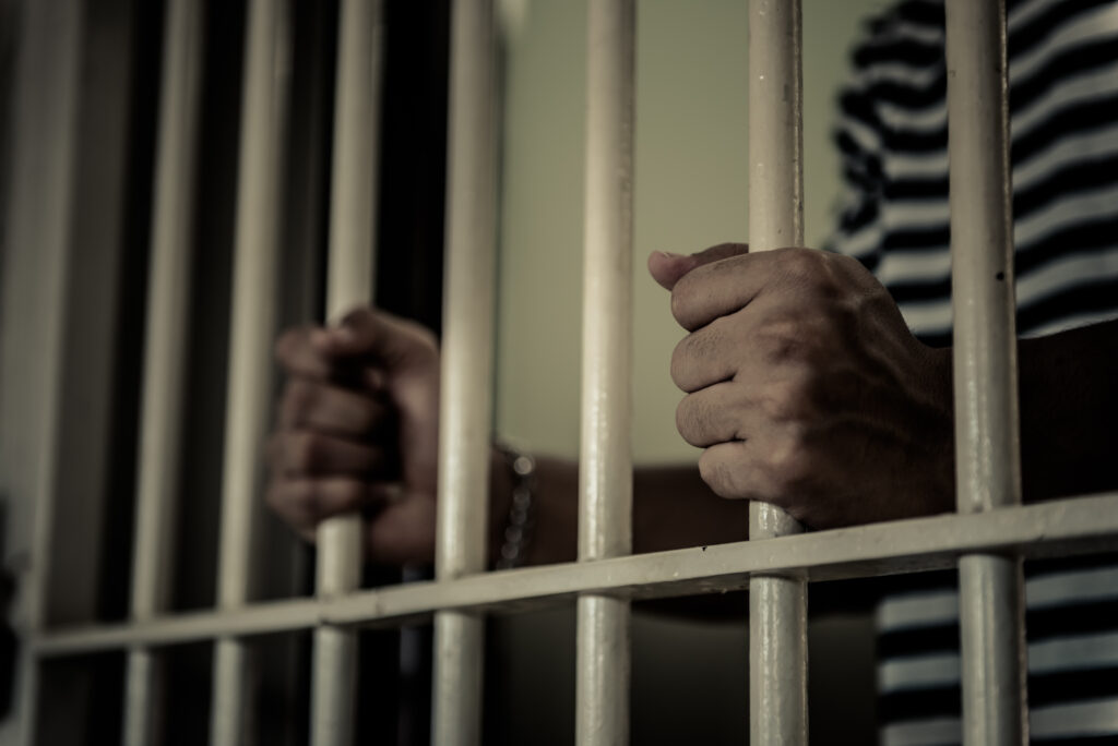 Hands of men desperate to catch the iron prison,prisoner concept