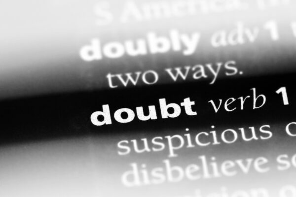 black and white photo of a "doubt" word in a dictionary.