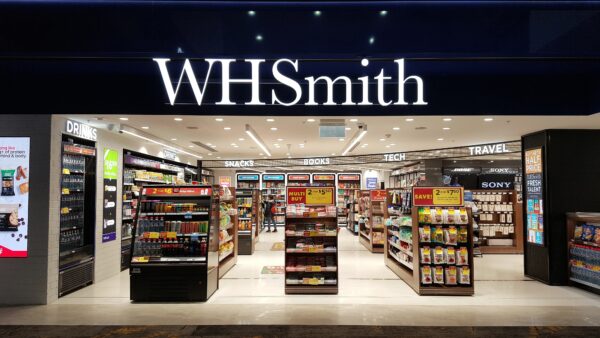 Selective focus view shop front view of WHSmith store at airport departure terminal.