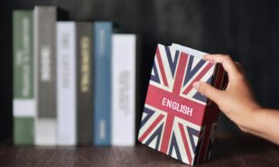 English book is selected from the bookshelf. Learning English fluently are advantages such as can connect to the foreigner, new bussiness, make more money, Increased Brainpower and Immigration Benefit