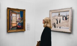 woman looking at painting