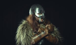 Man in Viking Costume on Black Background