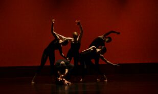 group of peopl performing on stage