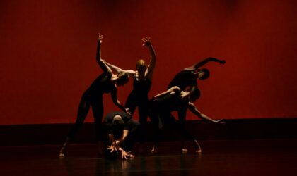 group of peopl performing on stage