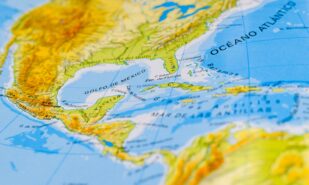 A world map is a graphic representation of the Earth on a plane, showing the globe divided into two projected hemispheres. The word "world map" comes from the medieval Latin mappa mundi, meaning "map