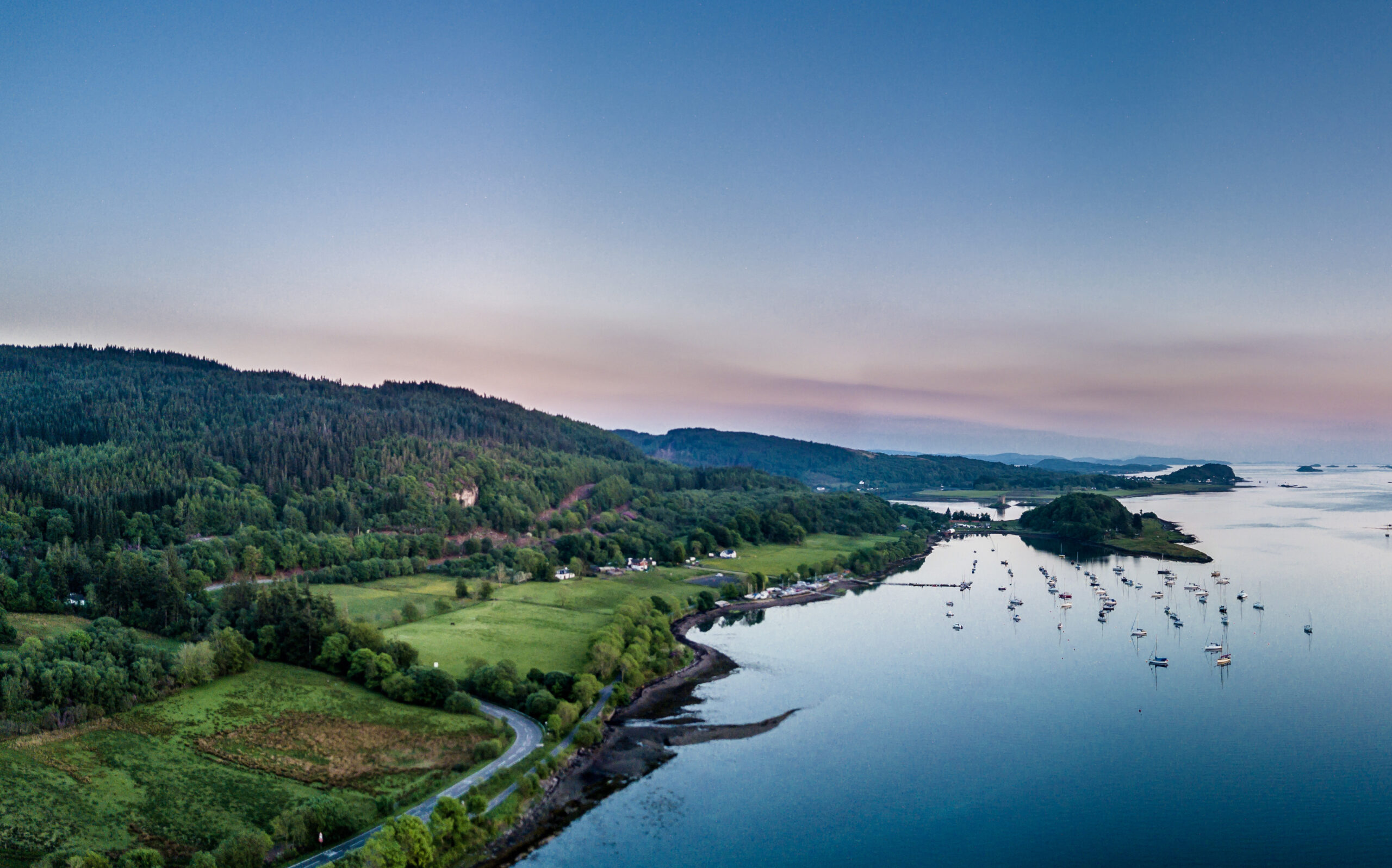 Aerial view of coast by Appin with views over Shuna Island and Arnamurchan, Scotland
