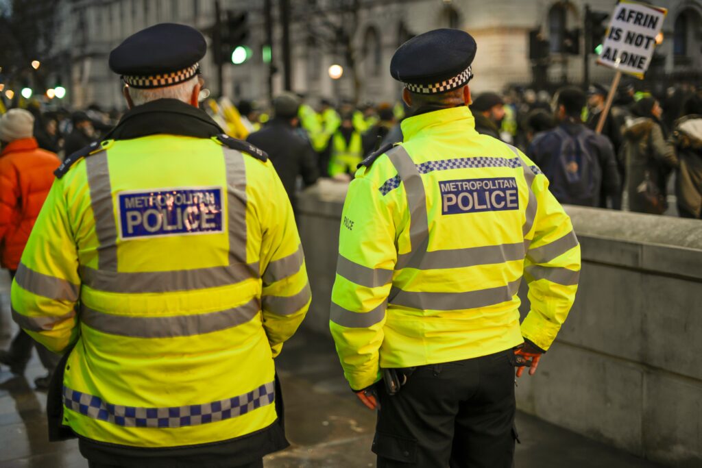 london police work near government house during protests