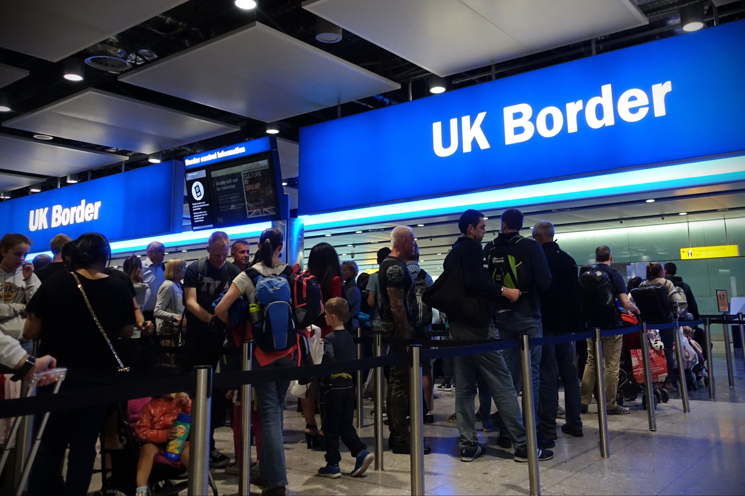 Air travellers queue at border passport control entrance gates at Heathrow Airport on August 24, 2018 in London, UK. The British aviation hub is the world's busiest by international passenger traffic.