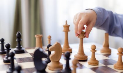 little boy is playing chess at home. High quality photo