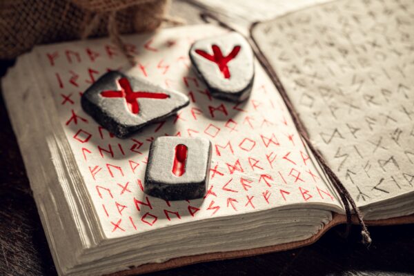 Top view of old rune stones omen based on antique futhark alphabet as mystical background