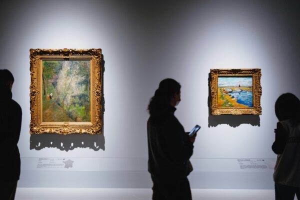 people admire art in a museum gallery