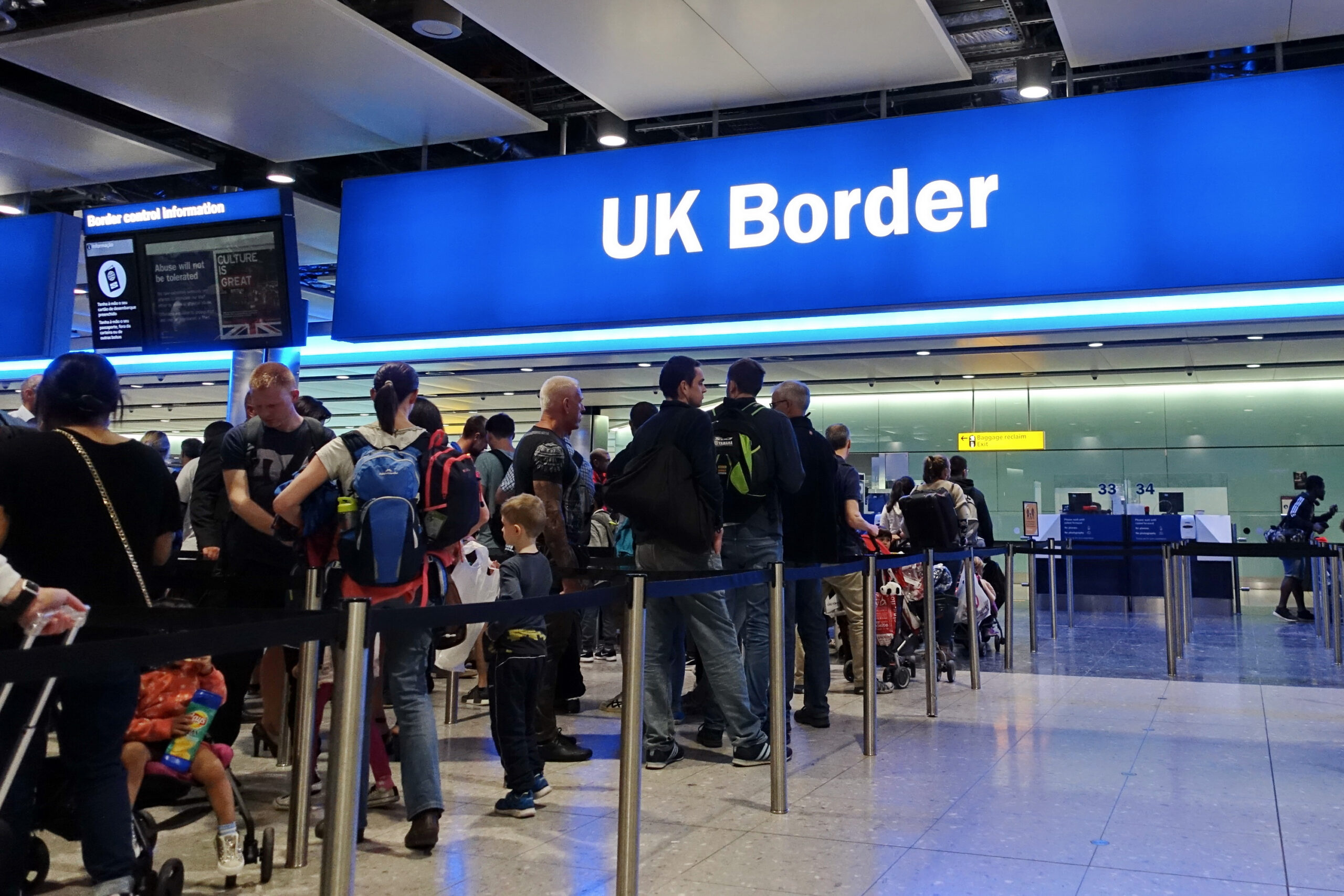 Air travelers queue at border control at Heathrow Airport. EU passengers face uncertainty as the UK is due to leave the EU in 2019 with a no deal on brexit possible.