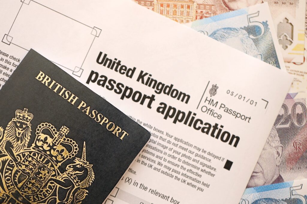 United Kingdom passport application form with British money passport close-up