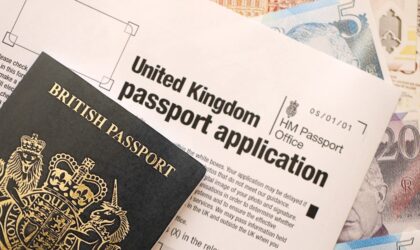 United Kingdom passport application form with British money passport close-up