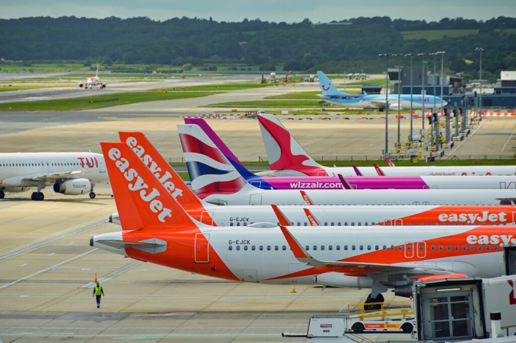 Row of planes of different airlines at London Gatwick Airport