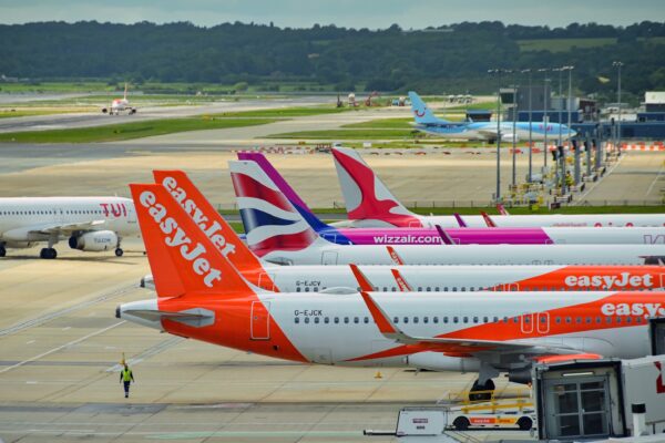 Row of planes of different airlines at London Gatwick Airport