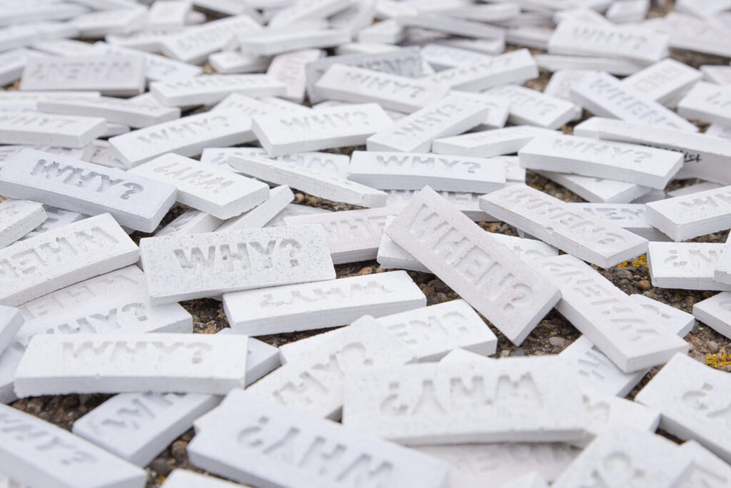 Tiles with the questions 'WHEN?' and 'WHY?' by artist 742