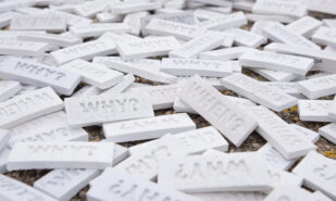 Tiles with the questions 'WHEN?' and 'WHY?' by artist 742