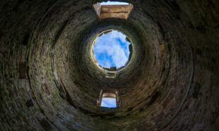 View of sky from the inside of tower ruin