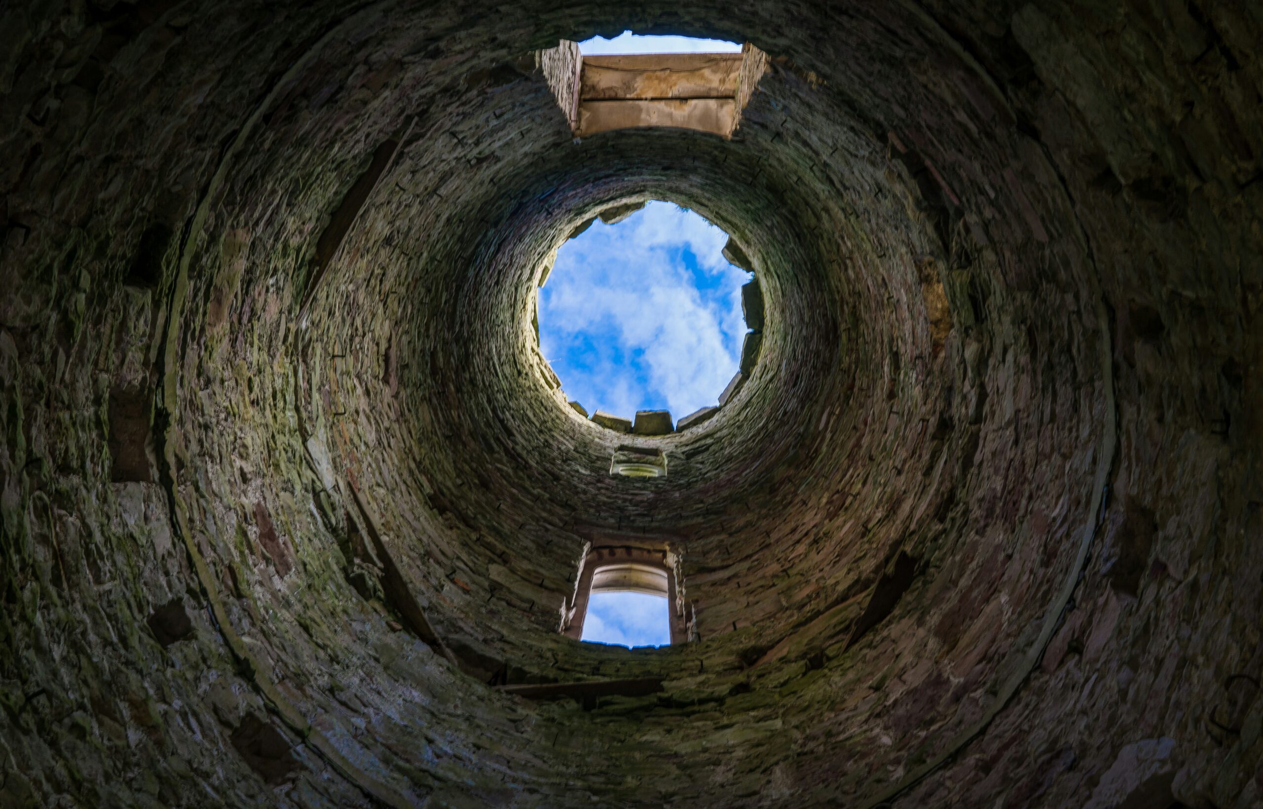 View of sky from the inside of tower ruin