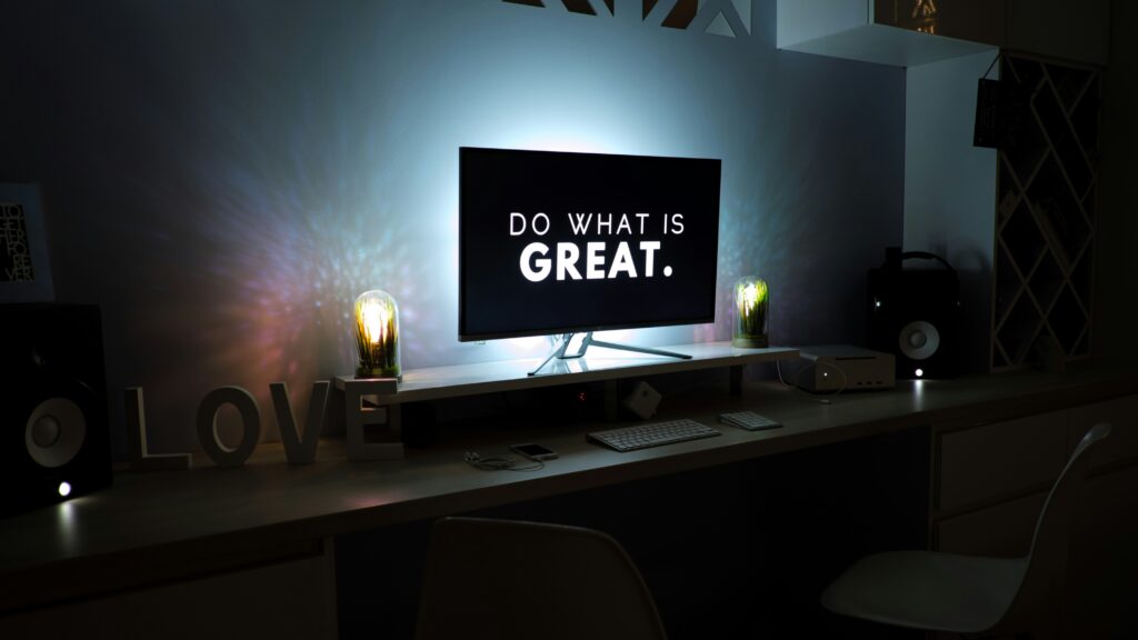 Screen with the text 'Do What Is Great' displayed. Photo by Martin Shreder / Unsplash