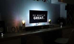 Screen with the text 'Do What Is Great' displayed. Photo by Martin Shreder / Unsplash