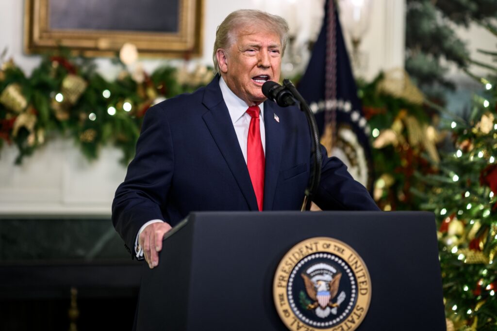 President Donald Trump addresses the nation on Wednesday from the reception hall of the White House diplomatic representatives.