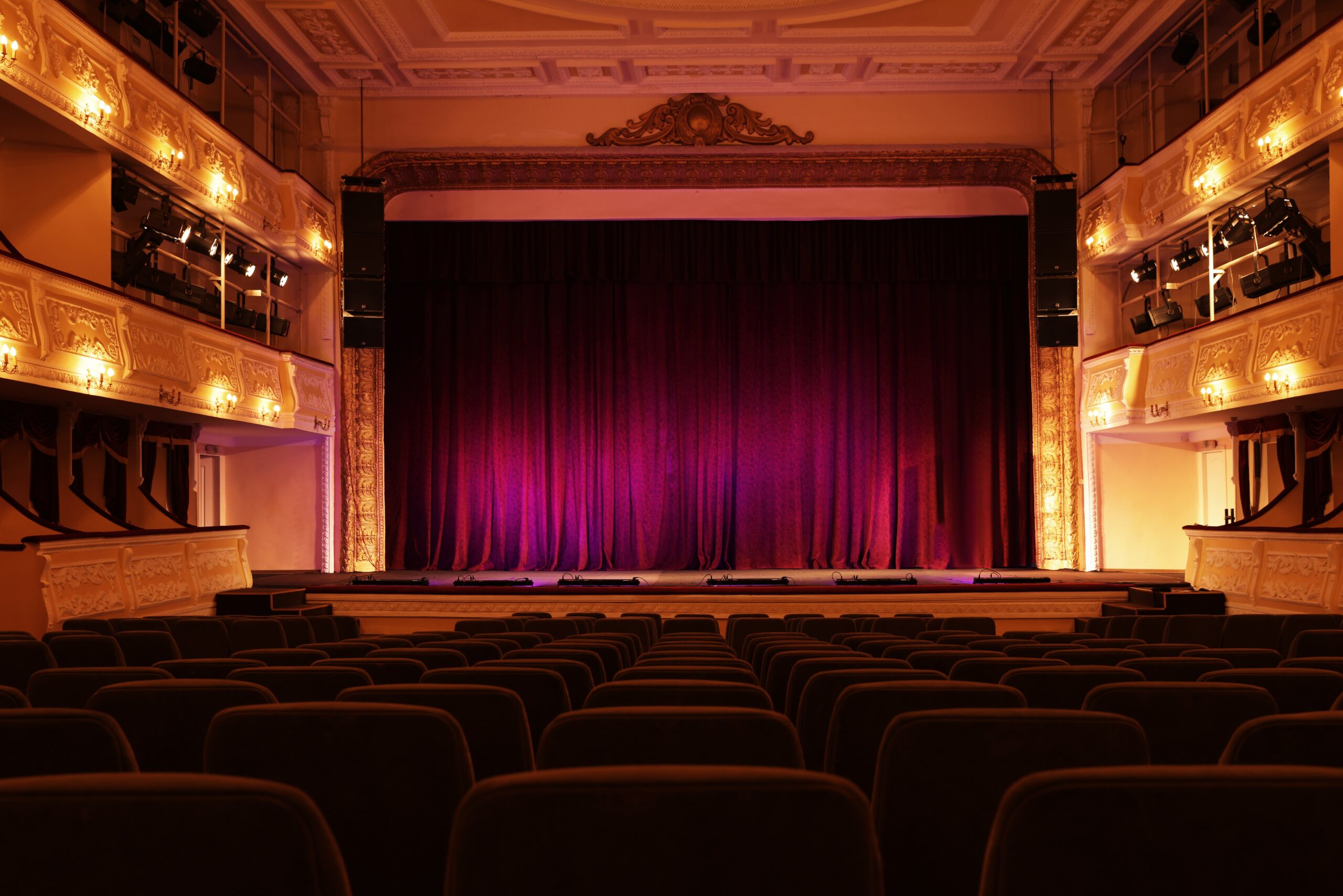 Theatre interior with stage and rows of comfortable seats
