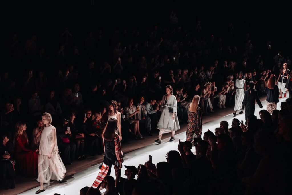 Fashion models in stylish outfits line up at the finale of a fashion show during Fashion Week